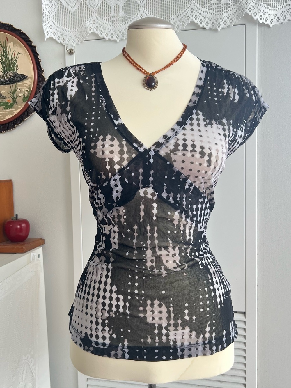 Y2K black & white geometric mesh top with ruffle sleeves and v-neckline